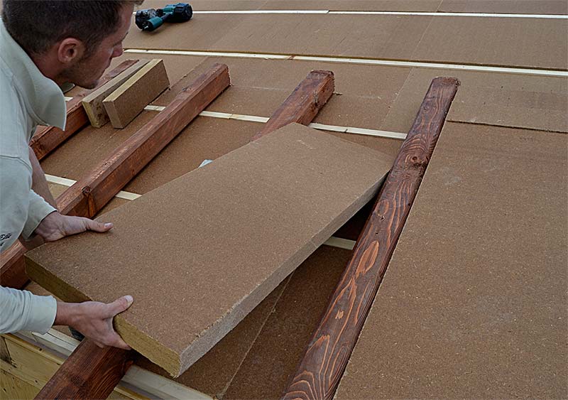 Fiber wood shop installation on roof s beams